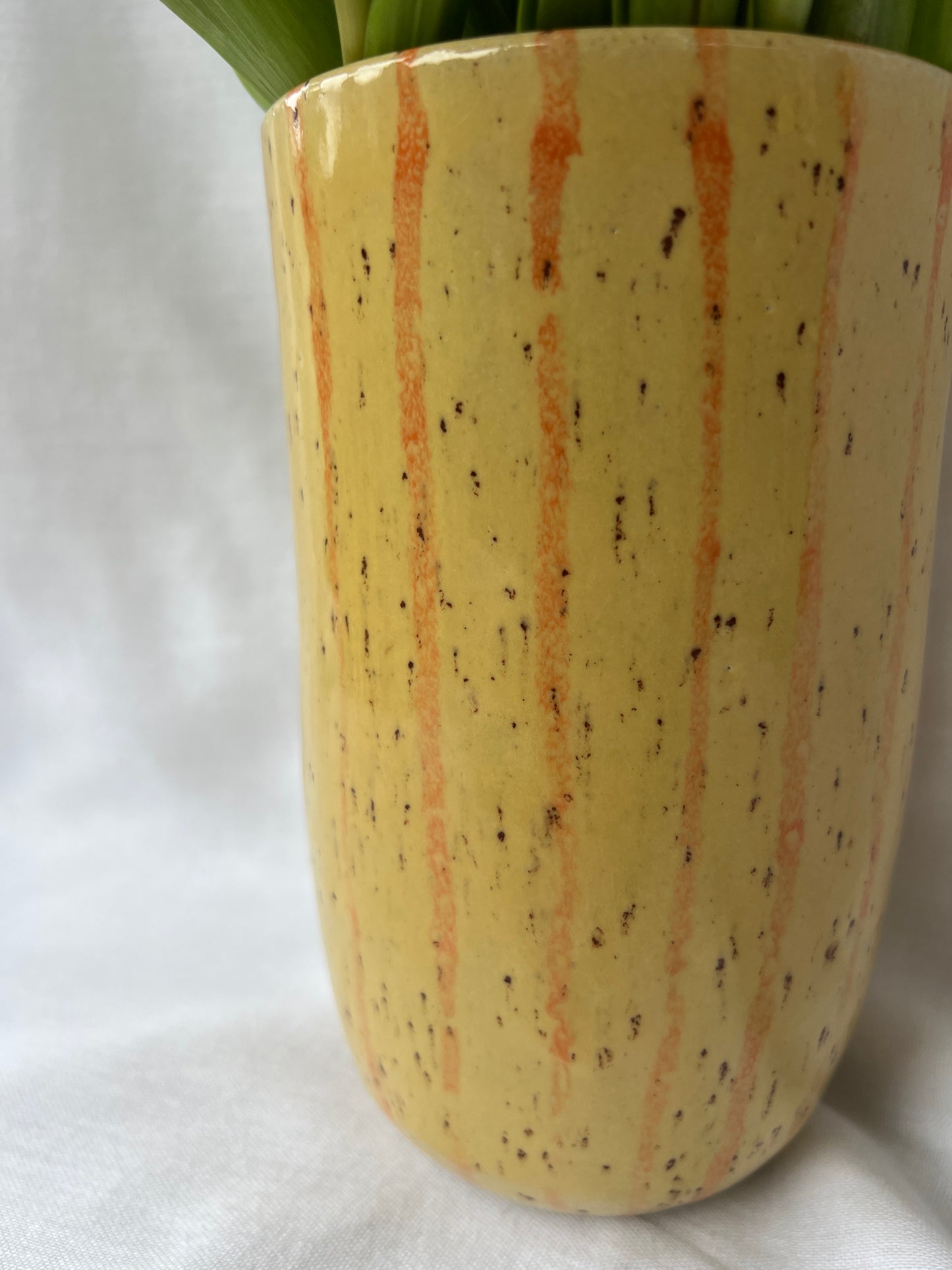 Speckled yellow and orange striped vase