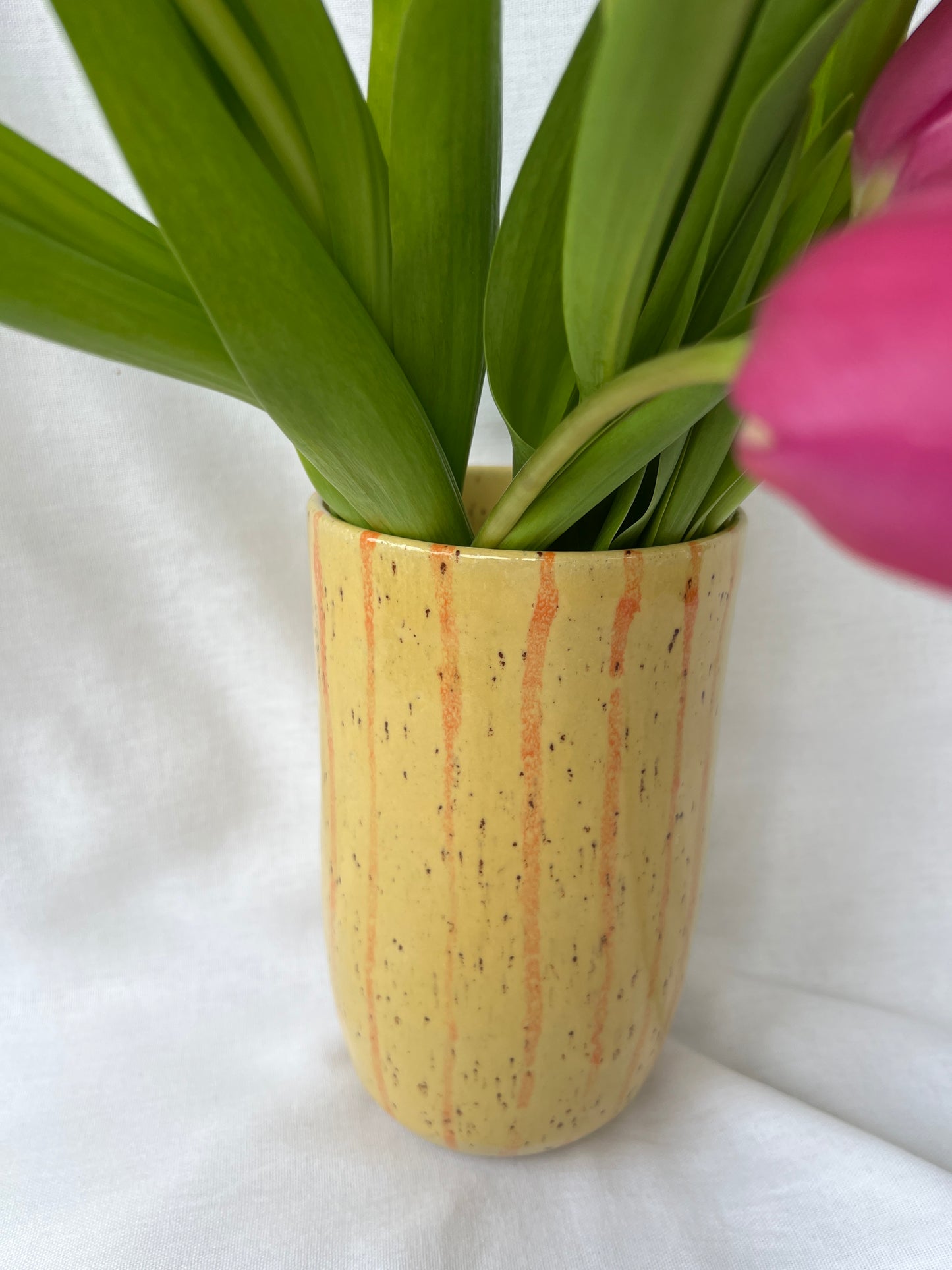 Speckled yellow and orange striped vase