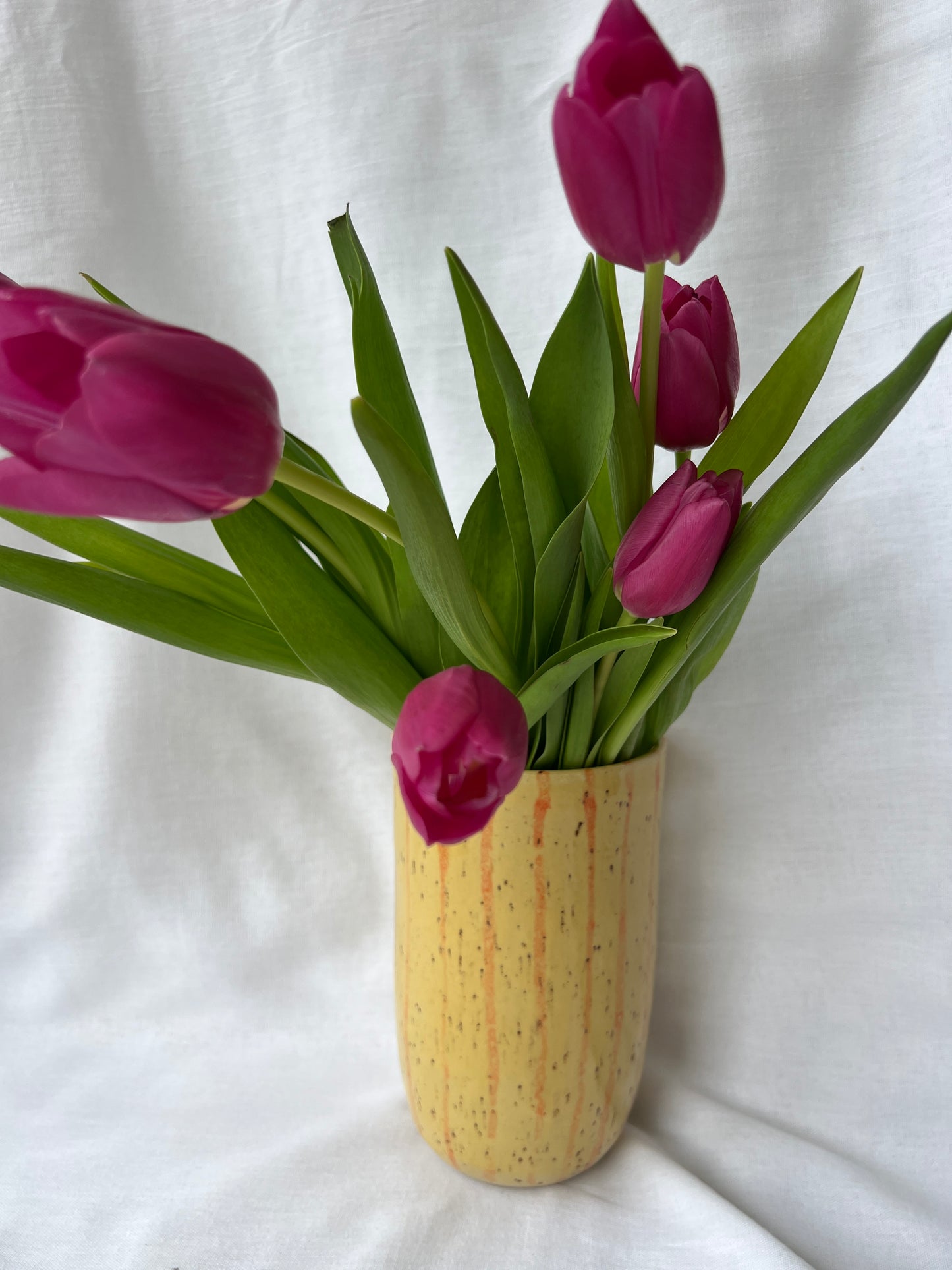Speckled yellow and orange striped vase